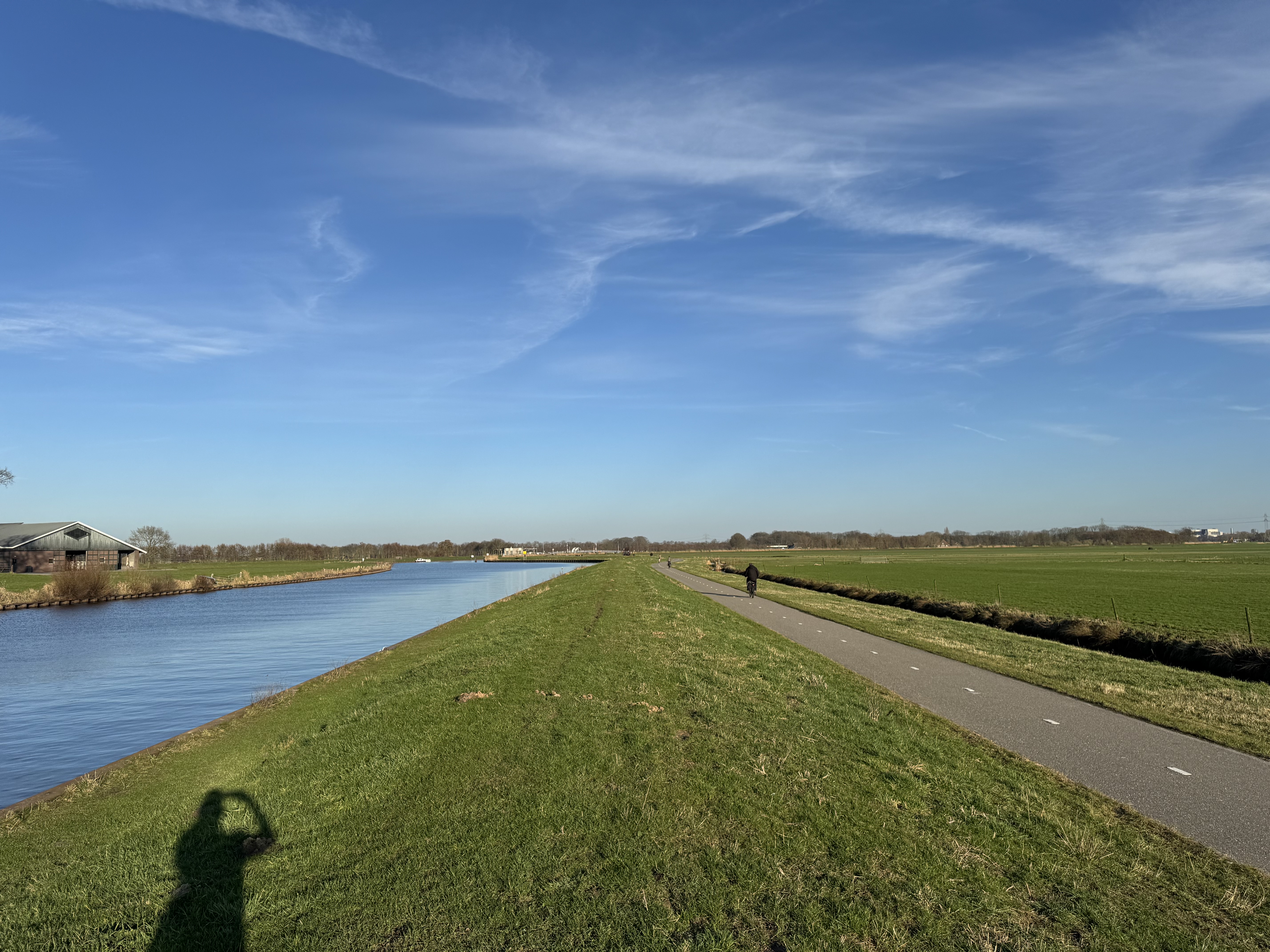 Open Dutch landscape near Soest: water, green fields, a path stretching under a wide sky